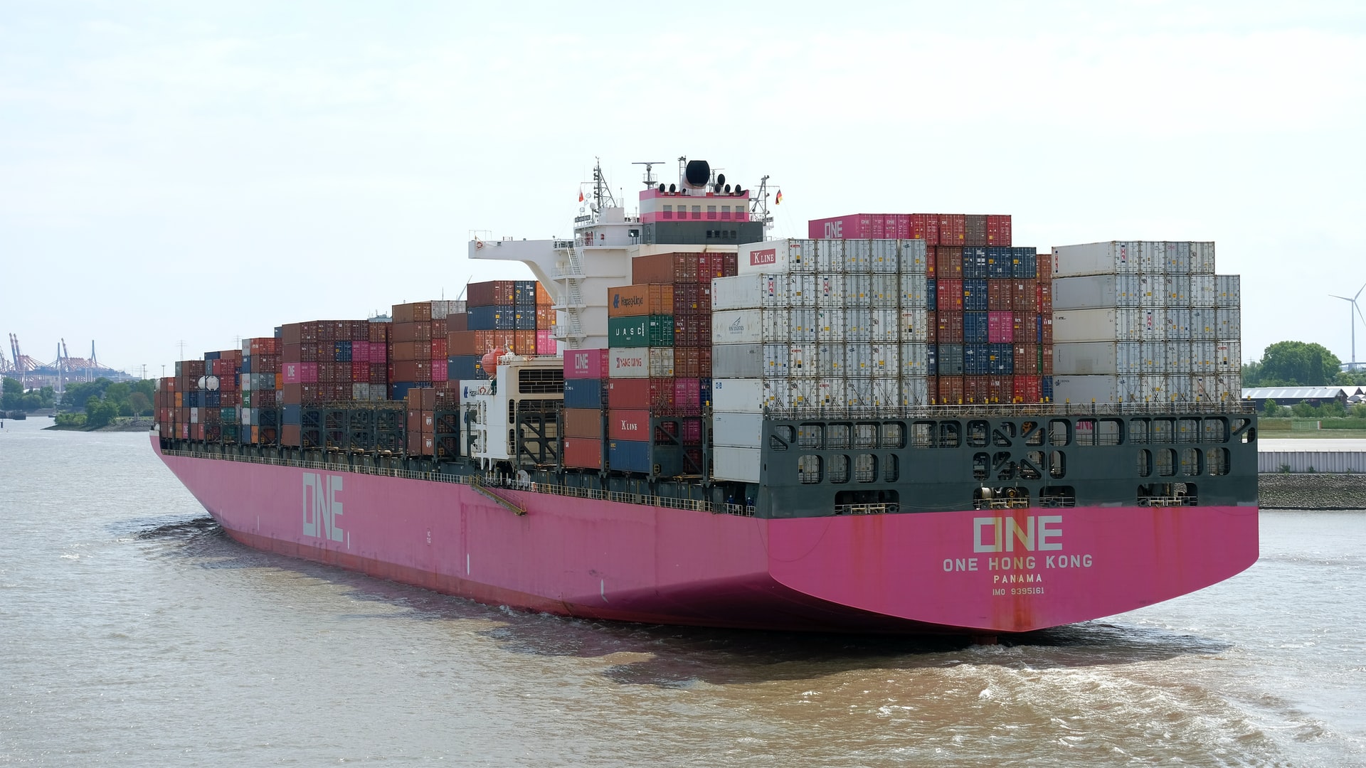 red and white cargo ship on sea during daytime