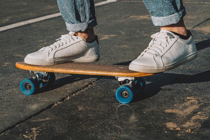 person riding skateboard on road